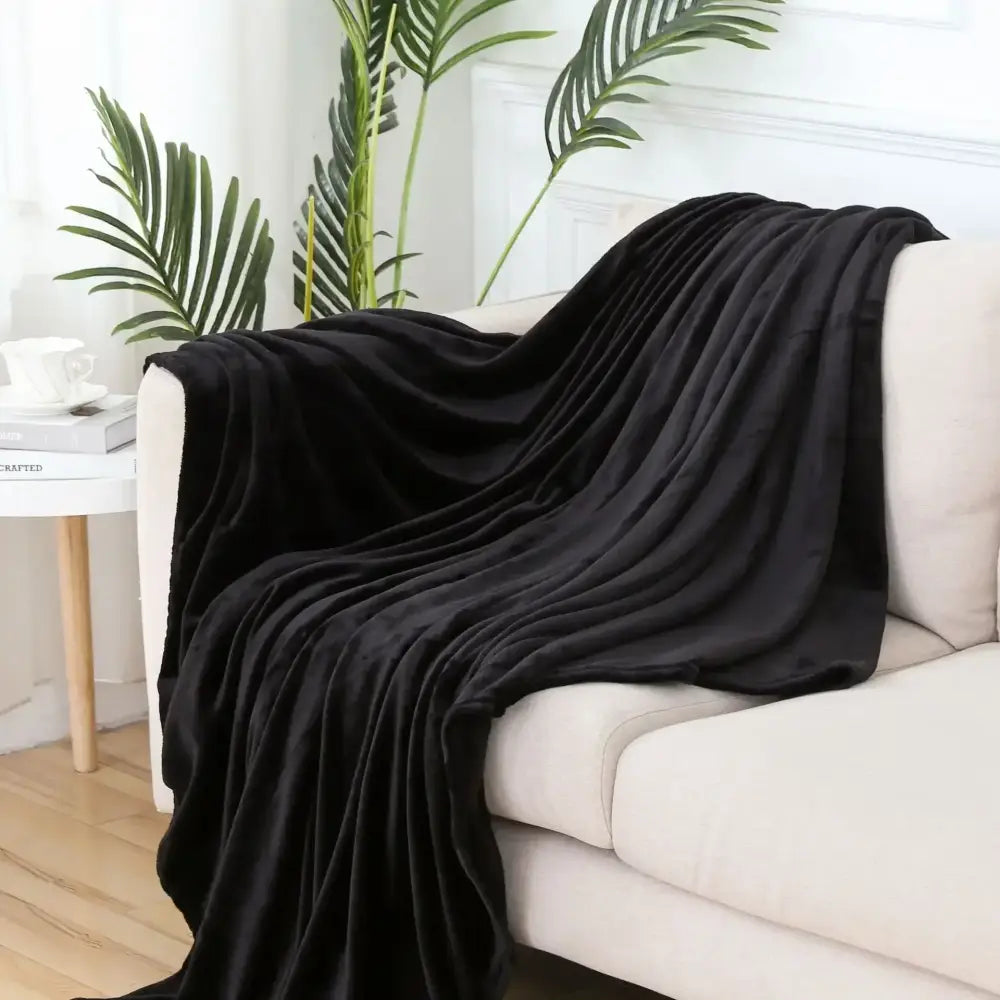 Soft gray cozy flannel plush throw blanket draped on sofa for decorbites cozy flannel warm bedroom decor