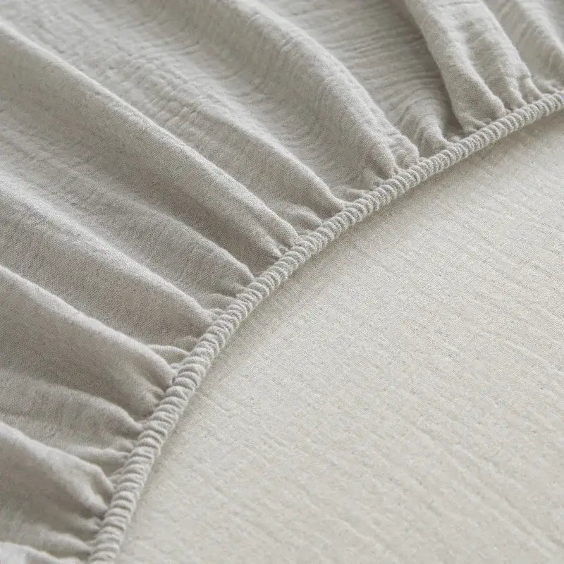 Soft light gray cotton fitted sheet with elasticized edge and soft textured weave cotton fitted sheet decorbites