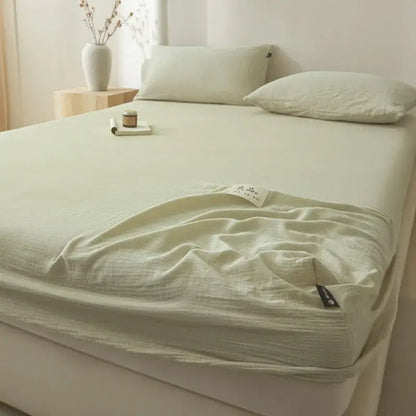 Soft light green cotton fitted sheet with subtle textured weave and neatly folded edges for decorbites cotton fitted use