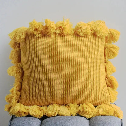 A vibrant yellow soft tassel knit cushion cover with textured ribbed pattern and fringe for living room decorbites decor