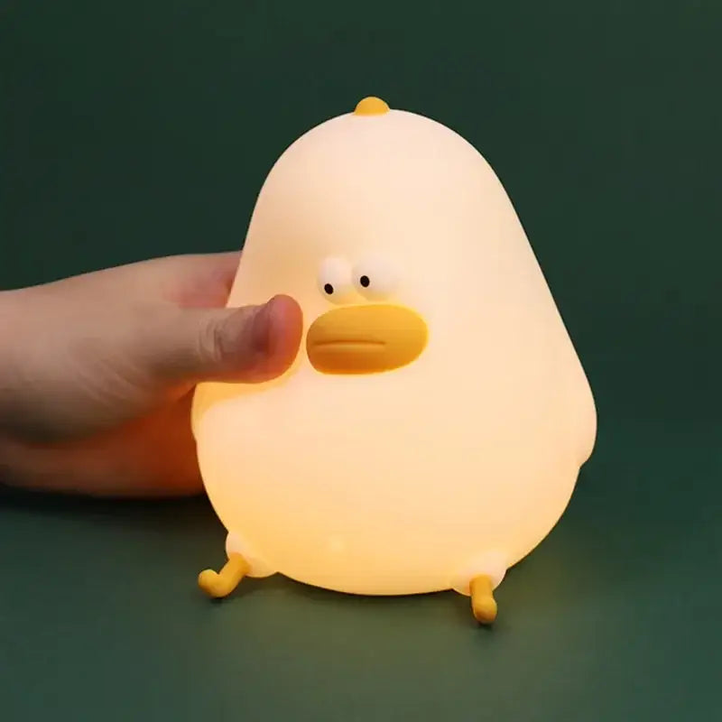 Soft yellow silicone fat chicken night light with smooth body and orange beak perfect as a bedroom led gift