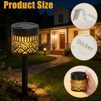 Black solar-powered garden light with gold-toned cut-out patterns cylindrical design for outdoor yard patio lighting