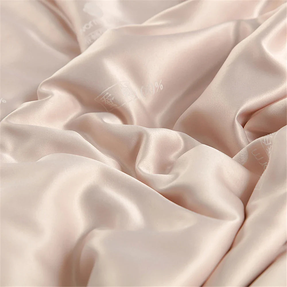 Sondeson luxury natural 100 percent silk quilt in blush pink satin with delicate embroidery for soft comfort