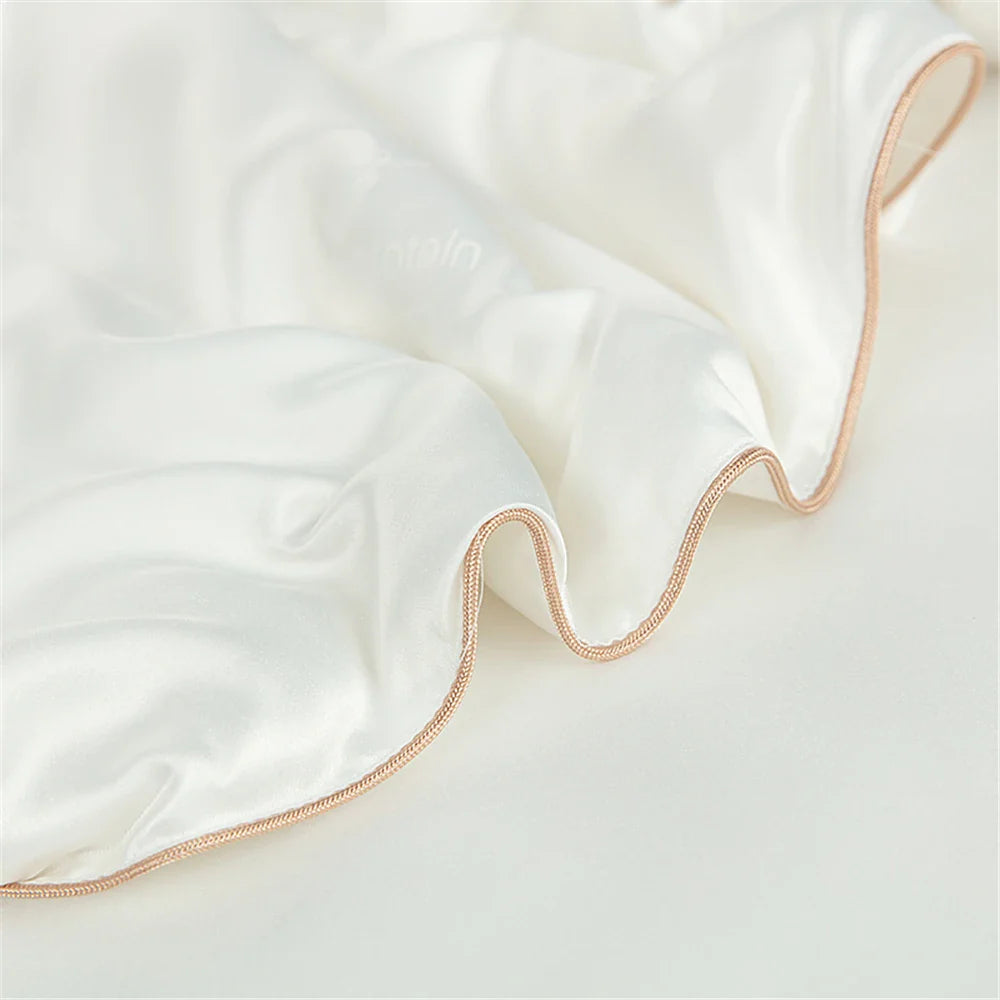 Sondeson luxury natural 100 percent silk quilt in white with delicate rose gold braided trim for soft comfort sleep