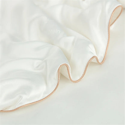 Sondeson luxury natural 100 percent silk quilt in white with delicate rose gold braided trim for soft comfort sleep