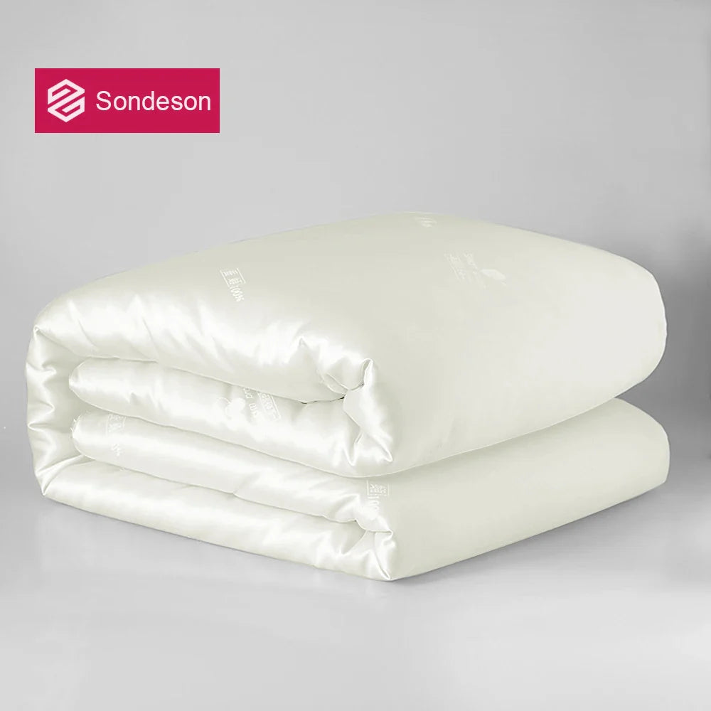 Sondeson luxury natural 100% silk quilt in white satin finish neatly folded for warm and soft sleep comfort