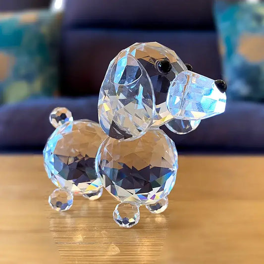 A sparkling clear crystal dog figurine with faceted transparent body and black bead eyes for bedroom decor