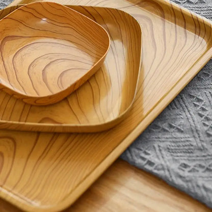 Set of three light wood-grain square imitation wood snack trays with smooth rounded edges and a glossy finish by decorbites