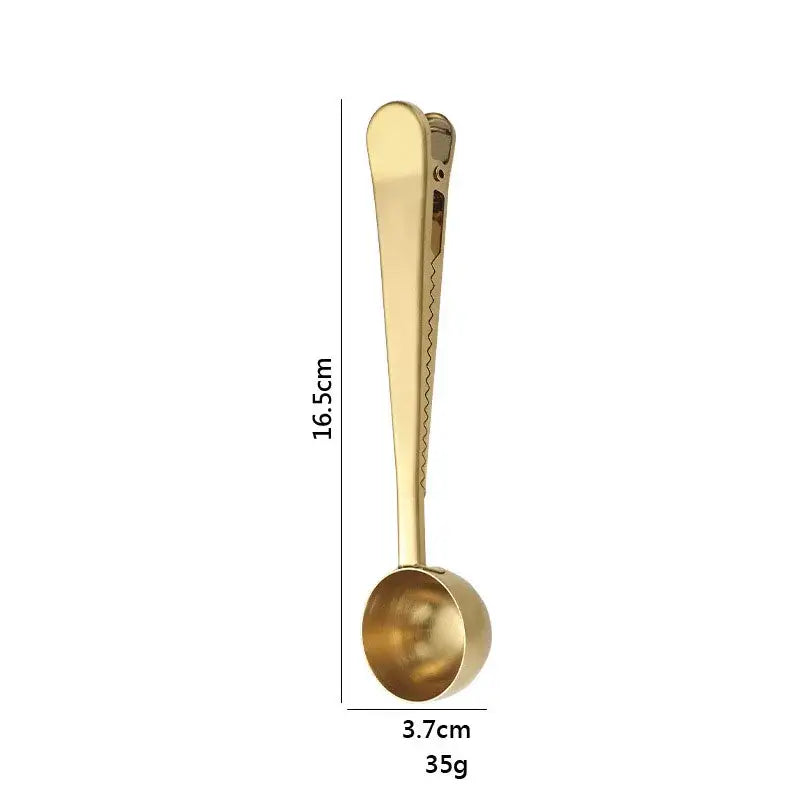 Gold-colored stainless steel coffee spoon with sealing clip measuring 16.5cm long and 3.7cm wide weighing 35g