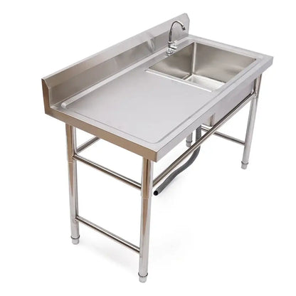 Stainless steel commercial kitchen sink with single basin, left platform, integrated faucet, and raised edge countertop