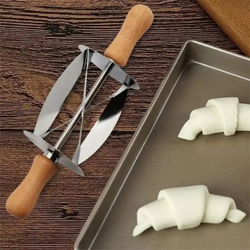 Stainless steel croissant dough cutter with wooden handles featuring a sleek modern design by decorbites