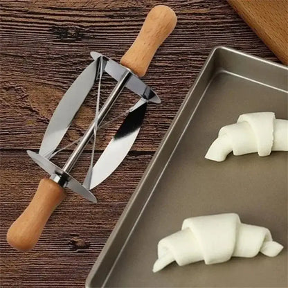 Stainless steel croissant dough cutter with wooden handles featuring a sleek modern design by decorbites