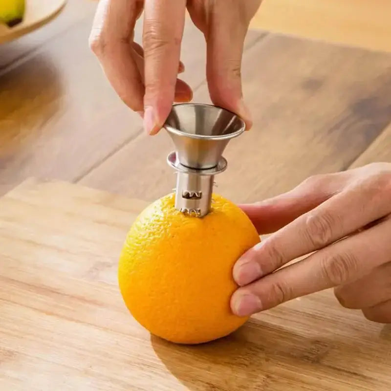 Stainless steel lemon squeezer juicer with conical top and serrated base for easy orange peeling by decorbites lemon squeezer