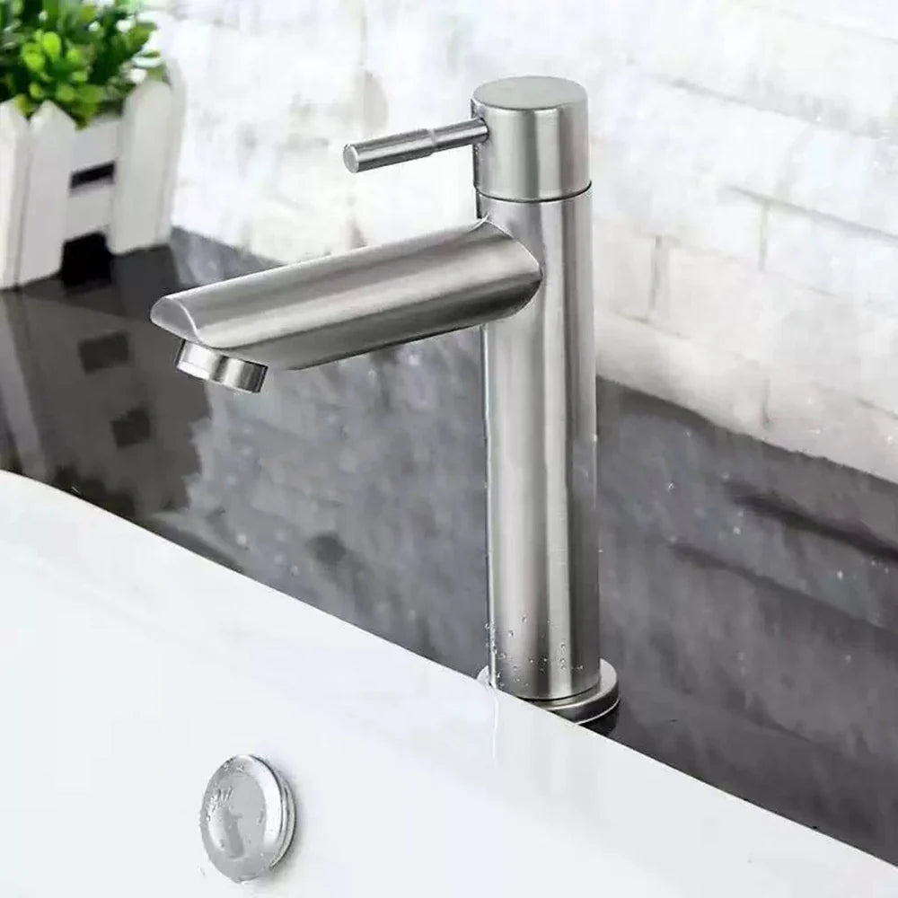 Modern brushed stainless steel single hole cold water faucet with sleek black deck mounted design for basins