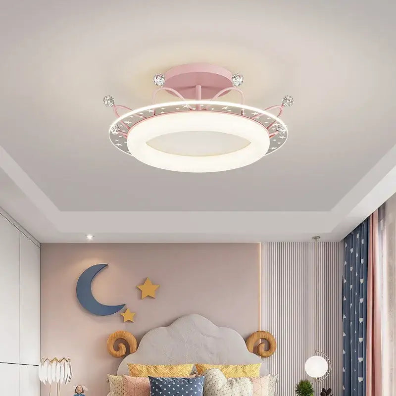 Pink circular ceiling light with decorative crown design and sparkling crystals ideal for decorbites kids room ceiling