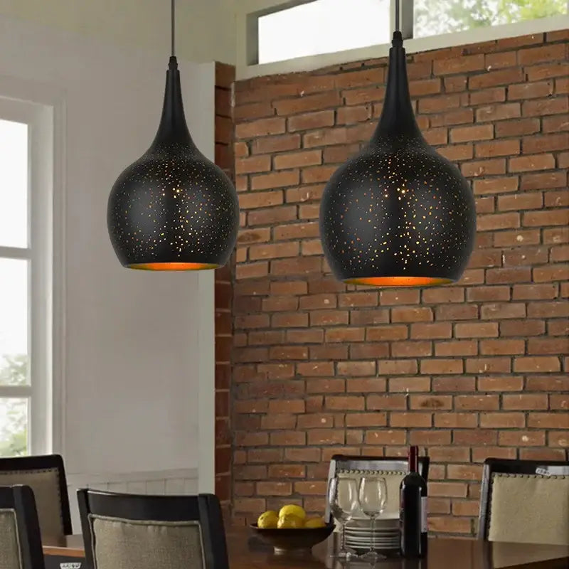 Black pendant light with speckled texture and warm orange glow decorbites black nordic pendant light for dining room