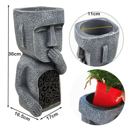 Stone gray easter island statue sculpture garden planter featuring a moai figure with hand-to-mouth gesture and black scrollwork panel