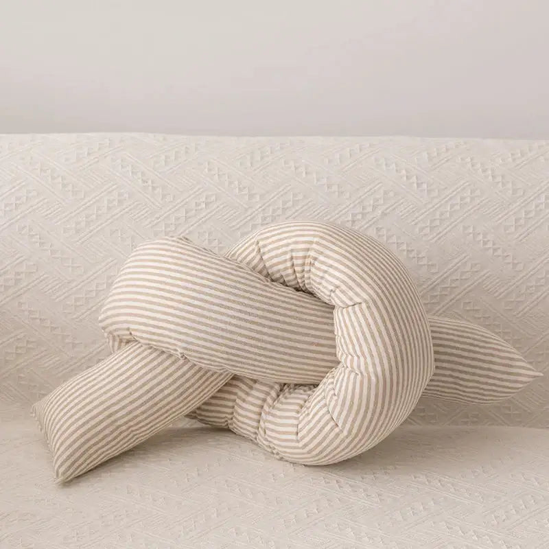 A soft cream-colored decorbites cloud star kids bedroom pillow with beige and white striped corduroy in star moon shape