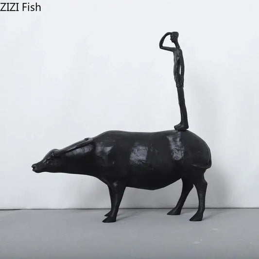 Stylized black matte metal cowherd shepherd boy sculpture standing atop a water buffalo for living room decorbites decor
