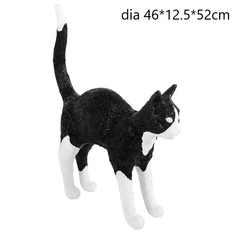 Stylized black and white cat resin table lamp with glossy finish for bedroom decor featuring decorbites black cat design