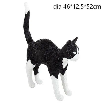 Stylized black and white cat resin table lamp with glossy finish for bedroom decor featuring decorbites black cat design