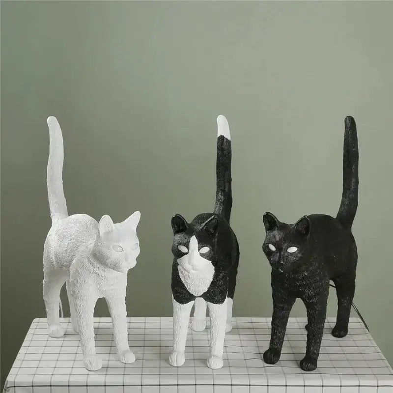 Three stylized cat resin table lamps in white black and white and solid black for bedroom decorbites black cat design