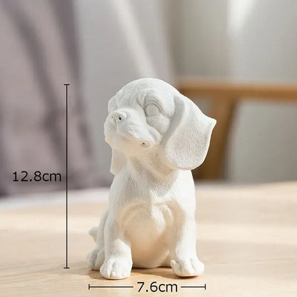Stylized white matte ceramic sculpture of a sitting beagle puppy miniature figurine for living room decor
