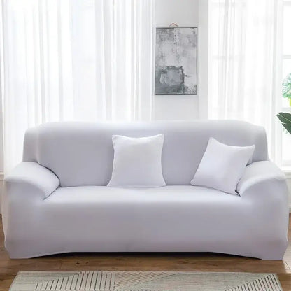 White stretchy silk sofa cover snugly fits three-seater couch with matching pillows for living room and accent chairs