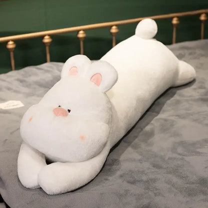 A plush tan white and beige dog sleeper body pillow shaped like a white rabbit with pink inner ears and cheeks for leg support