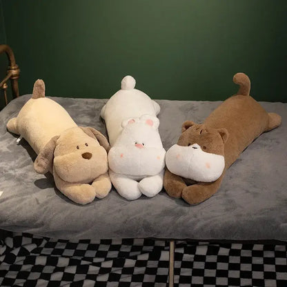 Three plush sleeper body pillows featuring a tan beige dog, white hippo, and brown cat with soft cuddly texture