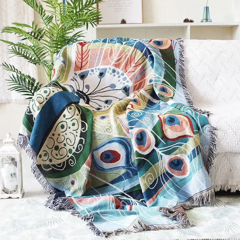 Teal and blue peacock knit sofa blanket cover with vibrant woven feather pattern and fringed edges for living room decorbites knit sofa