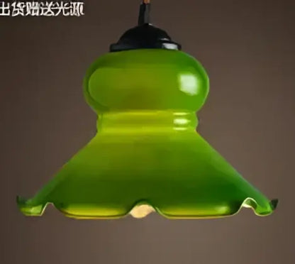 Teal blue glass pendant light with fluted bell-shaped shade and black metal fixture ideal for dining room decorbites blue glass pendant lights