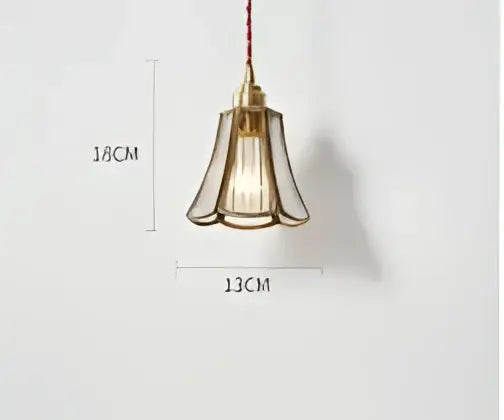 Teal blue glass pendant light with brass hardware featuring a fluted glass shade and exposed filament bulb for dining room decorbites blue glass pendant lights