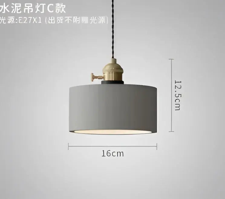 Gray cylindrical pendant light with brass finish and black cord complementing decorbites blue glass pendant lights
