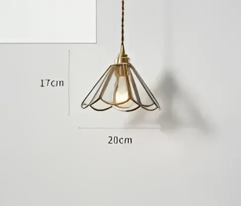 The pendant light features a teal blue glass pendant with antique brass petal-shaped frame and dark chain suspension