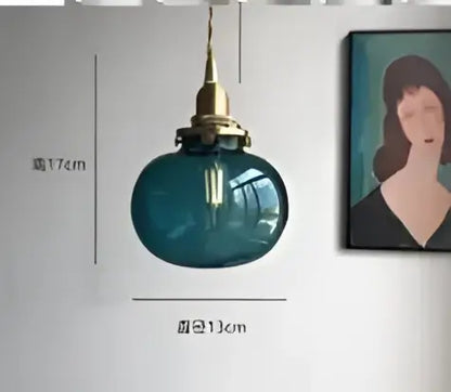 Teal blue glass pendant light with brass hardware featuring decorbites blue glass design for dining room pendant lights