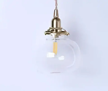 A clear glass pendant light with brass hardware and exposed filament bulb for dining room decorbites blue glass pendant