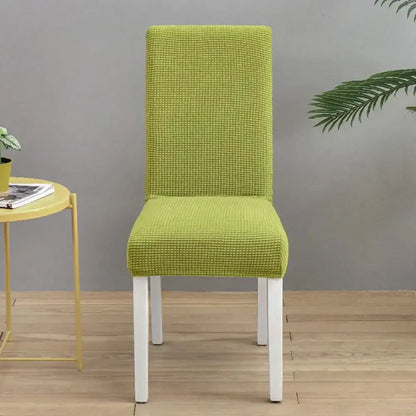 Teal blue quilted chair cover stretch elastic dining room protector on lime green textured white wooden chair