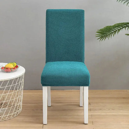 Teal blue quilted chair cover with stretch elastic fabric for dining room protection by decorbites