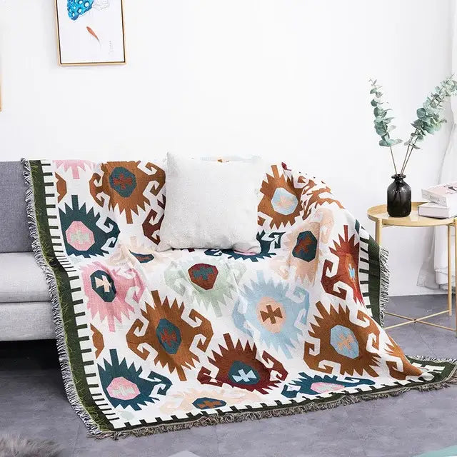 Cozy sofa blanket with dustproof butterfly carp pattern and teal geometric tribal designs featuring fringed edges