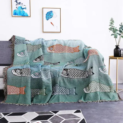 Teal sofa blanket with dustproof butterfly carp pattern featuring embroidered fish and fringed edges for living room use