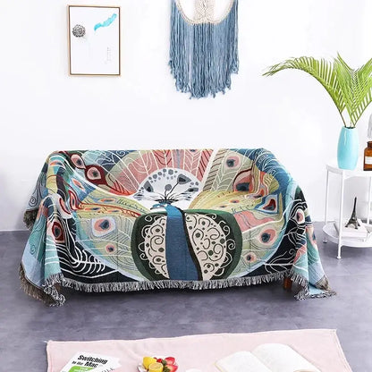 A vibrant teal sofa blanket with butterfly carp pattern and dustproof design draped over a living room sofa