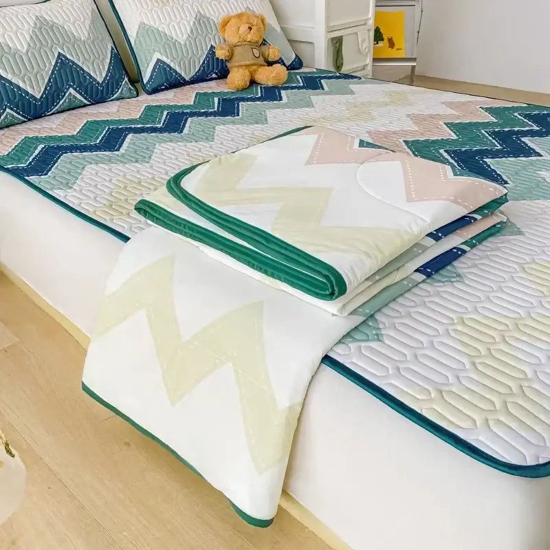 Folded teal and cream zigzag cool summer blanket set with stitched edges and white base for decorbites cool summer use
