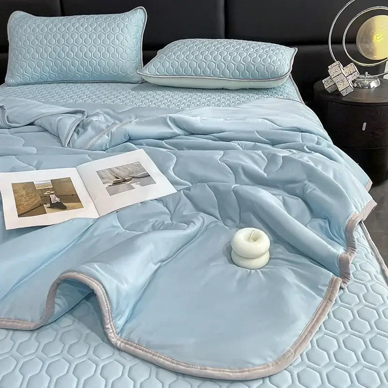Teal and cream zigzag cool summer blanket set featuring a light blue quilted bed set with satin finish decorbites cool summer