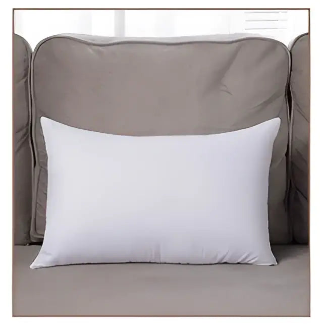White rectangular cushion resting on beige sofa featuring decorbites geometric embroidery tassel cushion case design