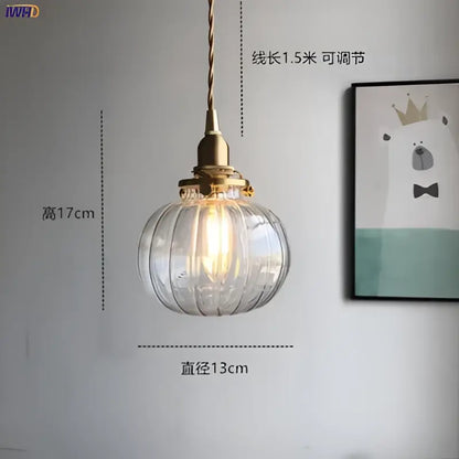 Teal glass ball pendant light with ribbed clear glass, brass hardware, and adjustable 1.5-meter cord for bedroom decorbites
