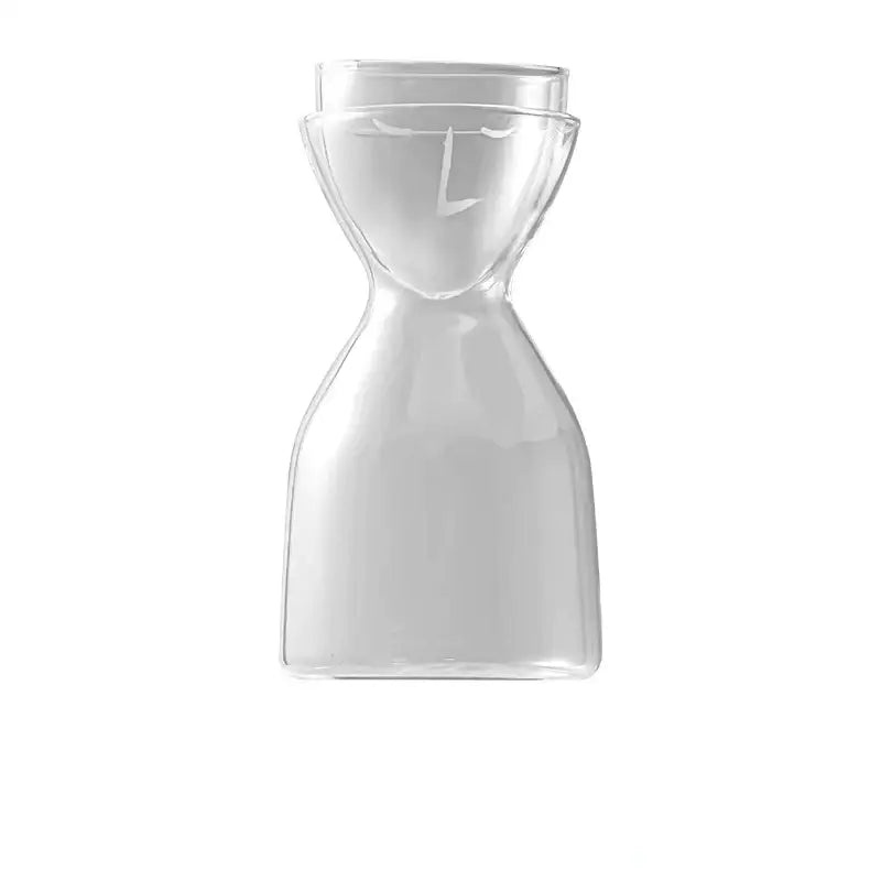 Clear hourglass-shaped teal glass tea infuser water bottle with minimalist etched face design for kitchen decorbites decor
