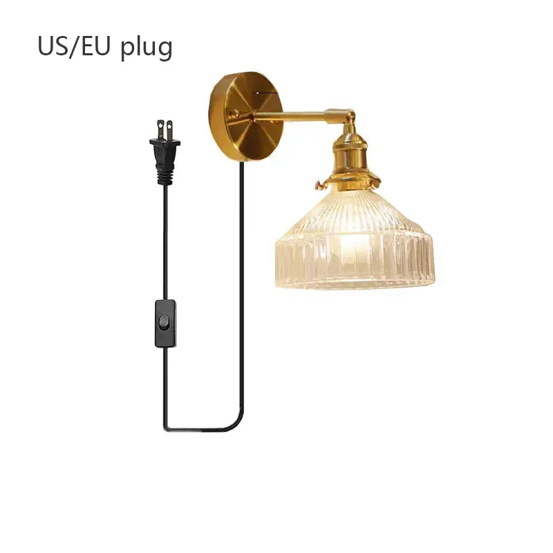 Gold-finished wall lamp with teal ribbed glass shade led and black cord with switch for luxury living room decor