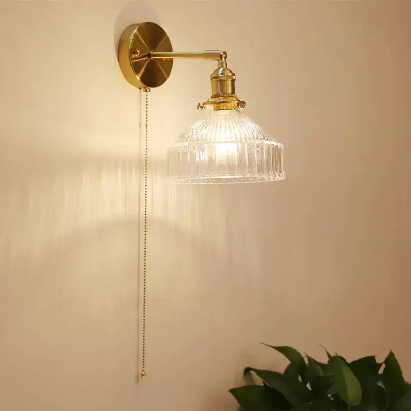 Brass-finished wall lamp with teal ribbed glass shade led and pull chain for luxury living room decor