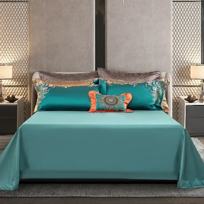 Teal satin bedding set with silver and gold embroidery featuring decorbites 1200tc jacquard and orange accent pillow